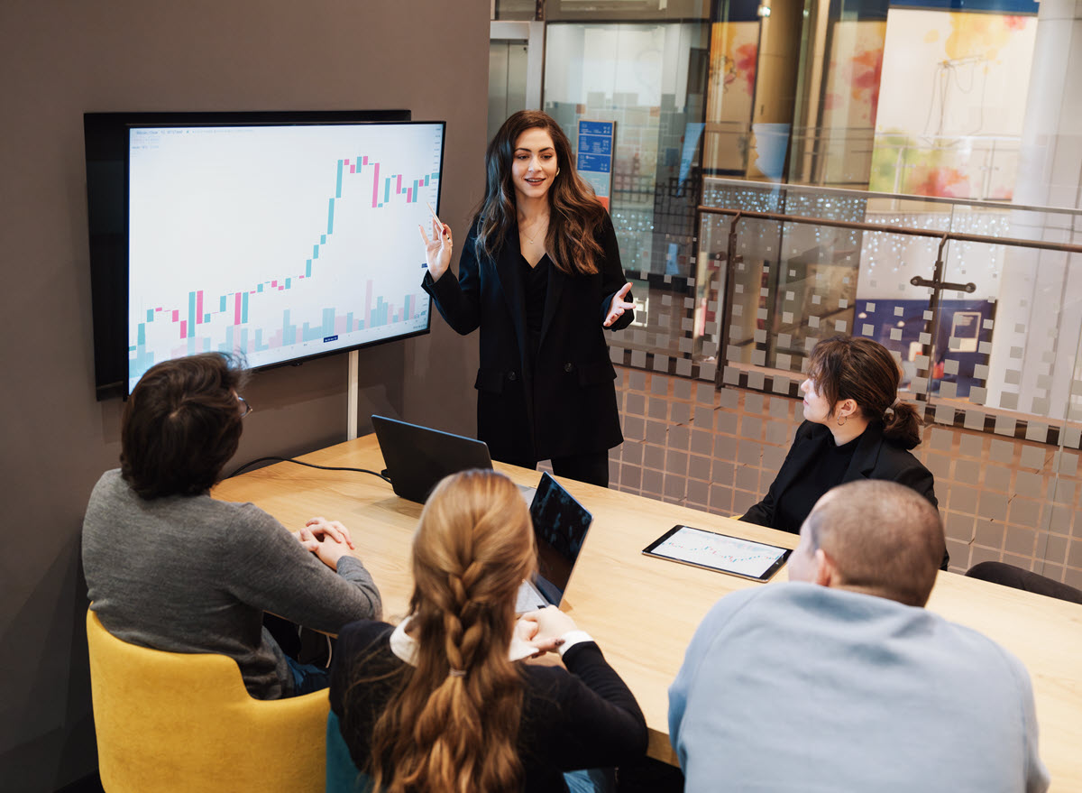 Woman presenting with charts