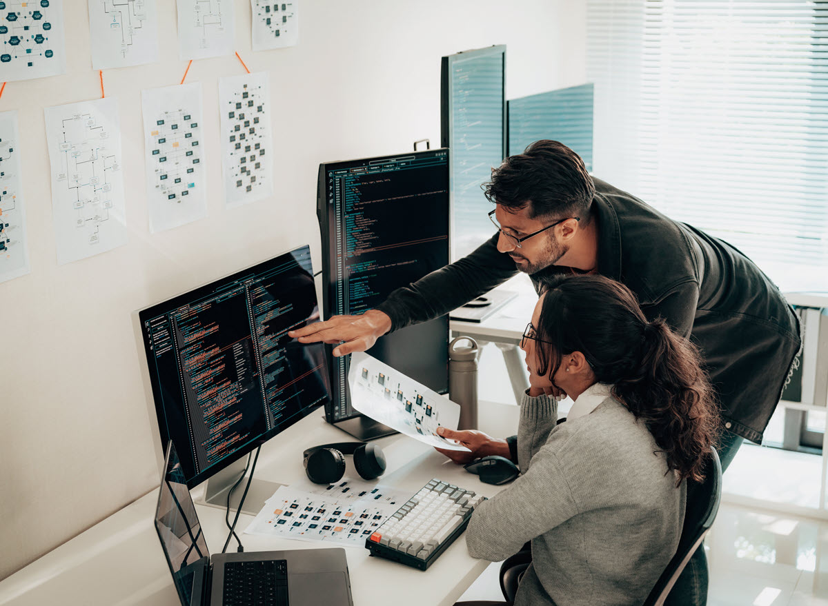 Man and woman collaborating at a computer