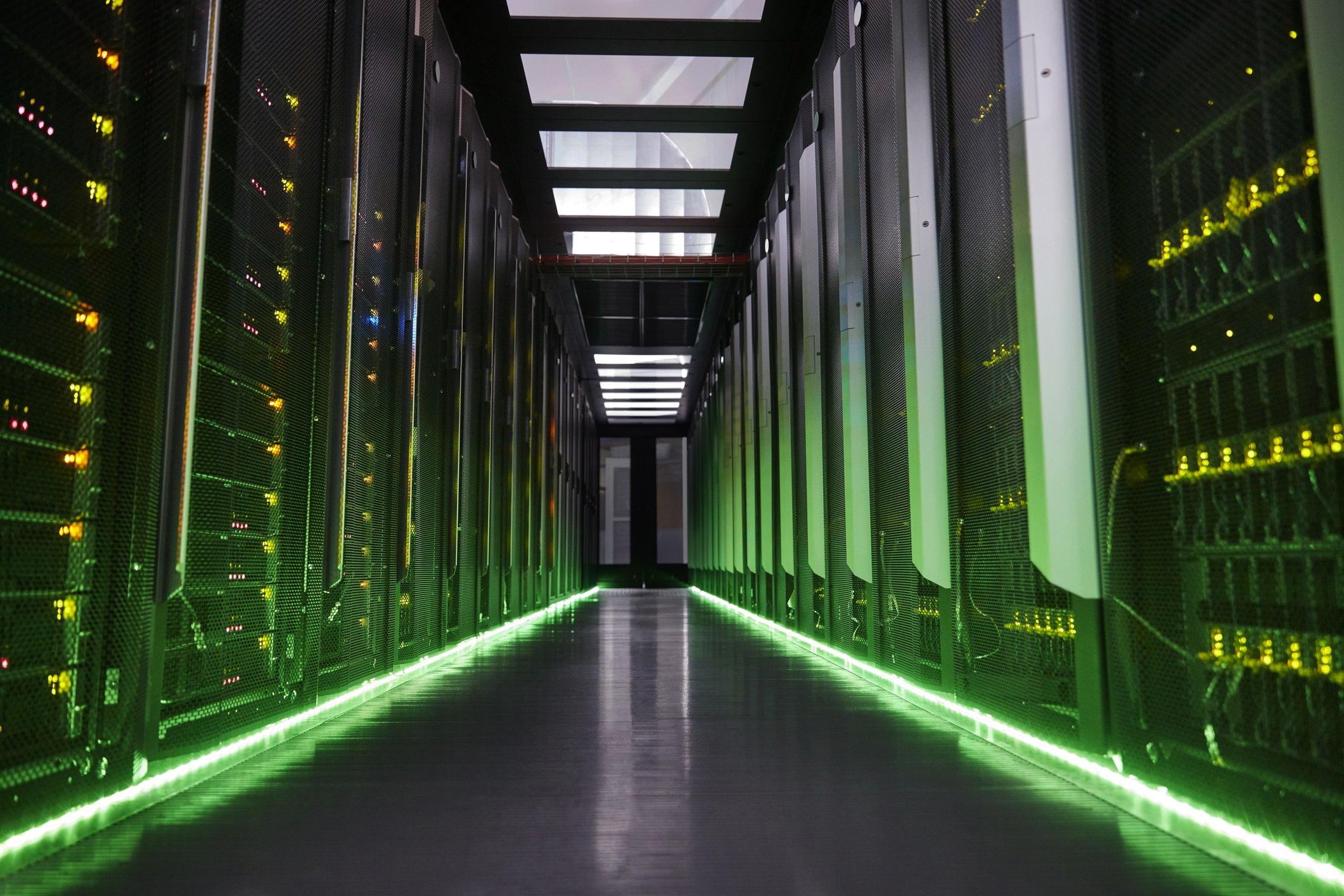 Inside of data center with green lights
