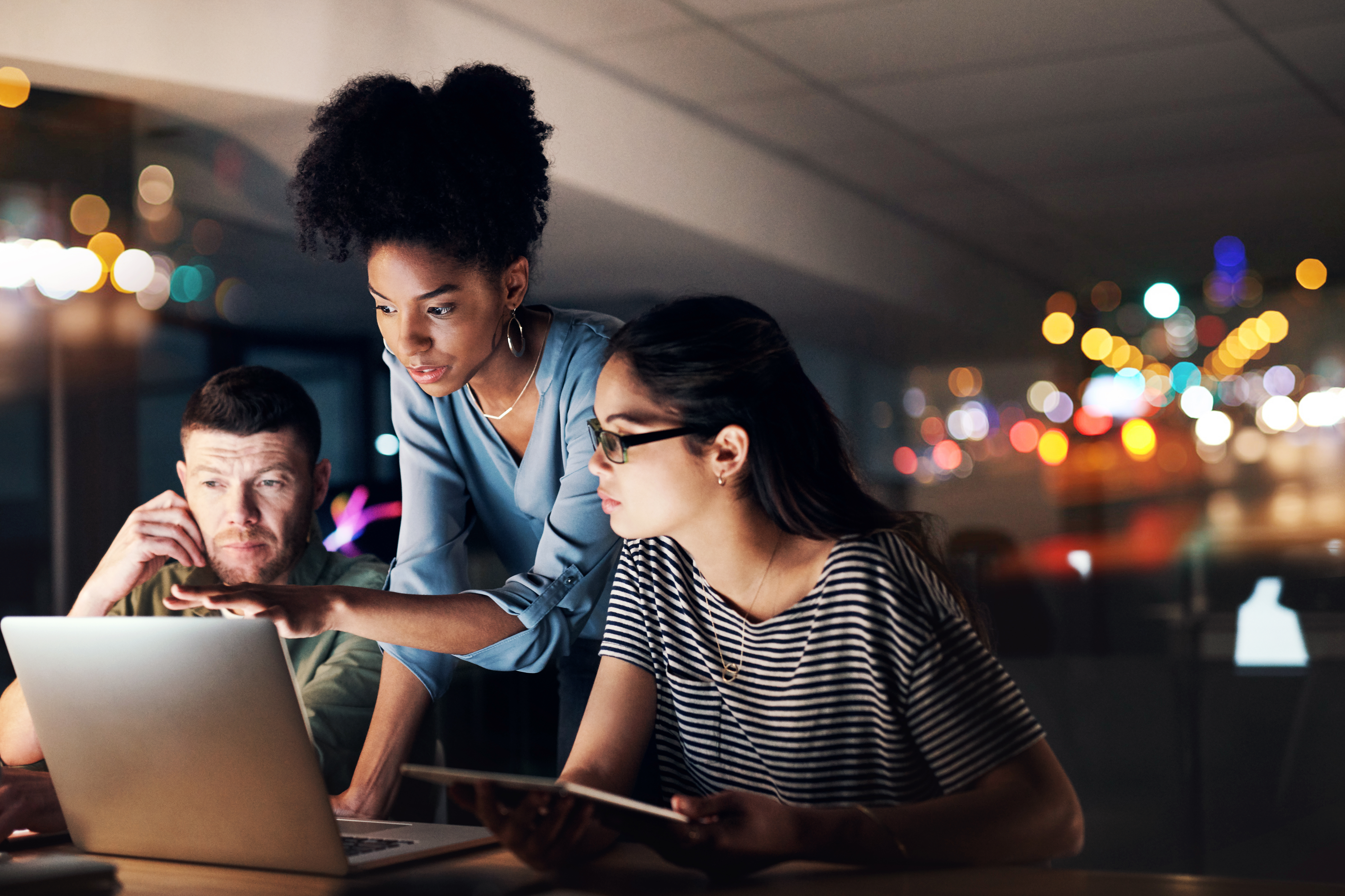 Ciena employees volunteering in a field 