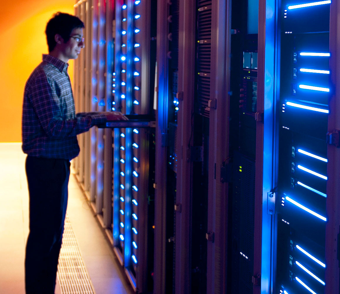 Man standing in front of server