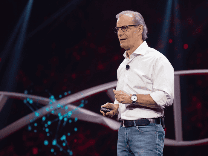 Ciena's CEO Gary Smith standing at a podium