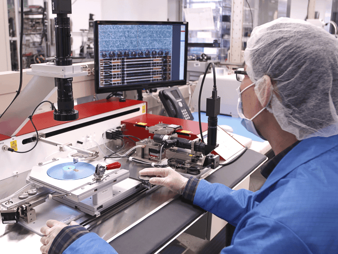 a person working on a computer in a lab