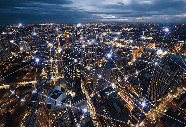 an ariel view of city buildings with lights connecting in different spots